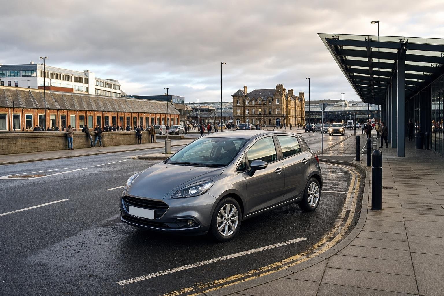 Compact hire car near a town-centre station approach in Worksop